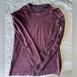 Lululemon size 12 long sleeve with thumb holes.